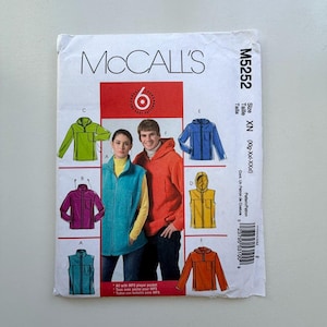 May include: McCall's sewing pattern M5252 featuring various jacket and vest designs. The pattern includes images of a teal vest, orange hoodie, and other colorful jacket options. The pattern size is XN (Xlg-XXl-XXxl).