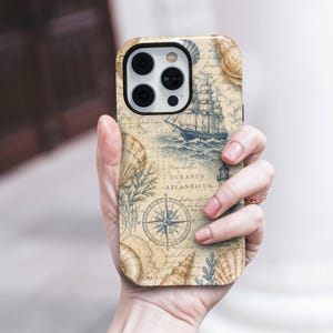 May include: A smartphone case featuring a vintage-style nautical map design with a sailing ship, a compass rose, and various seashells. The background has a beige parchment texture with the text Oceanus Atlanticus printed in black ink.