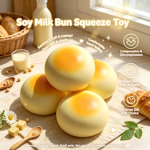 May include: A stack of four yellow and orange soy milk bun squeeze toys. The toys are round with a yellow base and an orange center. Text on the image reads "Soy Milk Bun Squeeze Toy", "Squeeze it. Soft & creamy!", and "Super soft & elastic".