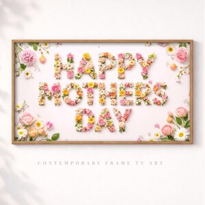 May include: A rectangular wooden framed artwork with the words "HAPPY MOTHERS DAY" spelled out in colorful flowers. The artwork is on a white background with the text "CONTEMPORARY FRAME TV ART" at the bottom.