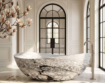 May include: A luxurious marble bathtub with a unique oval shape. The tub features a striking black and white veined pattern. A silver faucet stands beside the tub. The bathroom has large windows and a black framed door.