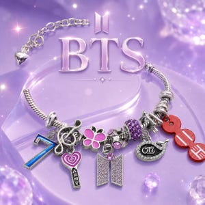 May include: A silver-toned charm bracelet featuring various pendants including a blue number 7, a treble clef, a pink heart with the text ARMY, a pink butterfly, a purple crystal-encrusted BTS logo, a whale charm with OT7, and a red circular charm.