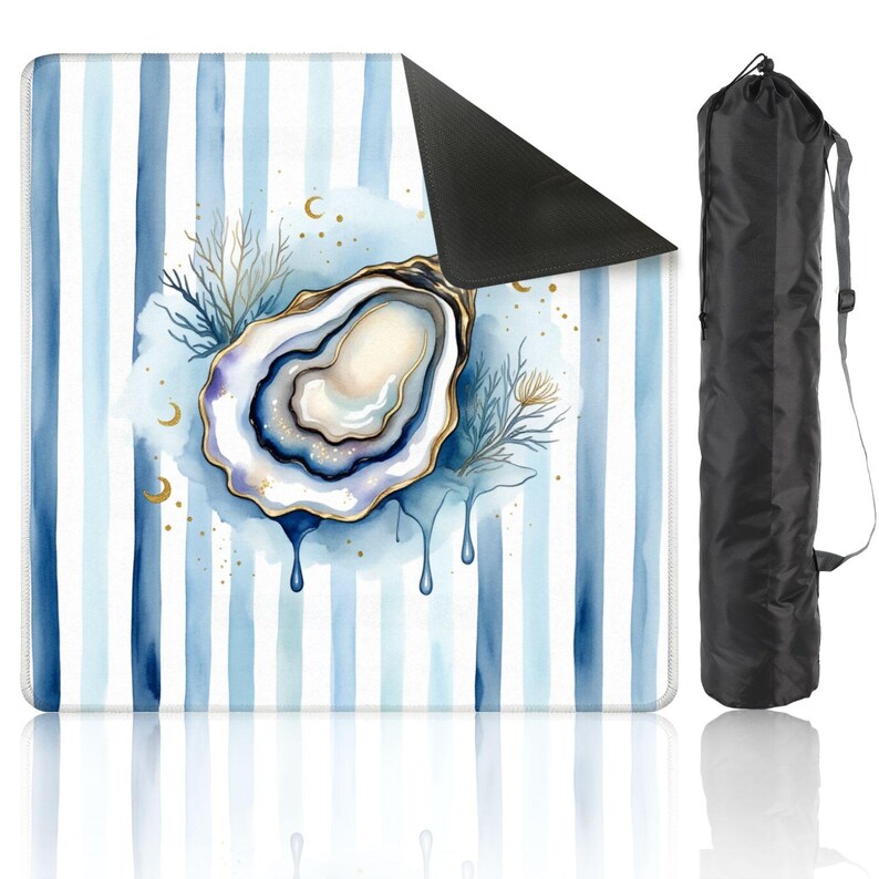 May include: A yoga mat with a watercolour design. It features a blue and white striped background and an oyster illustration with gold accents. The oyster is surrounded by blue and gold details. A black carrying bag is included.
