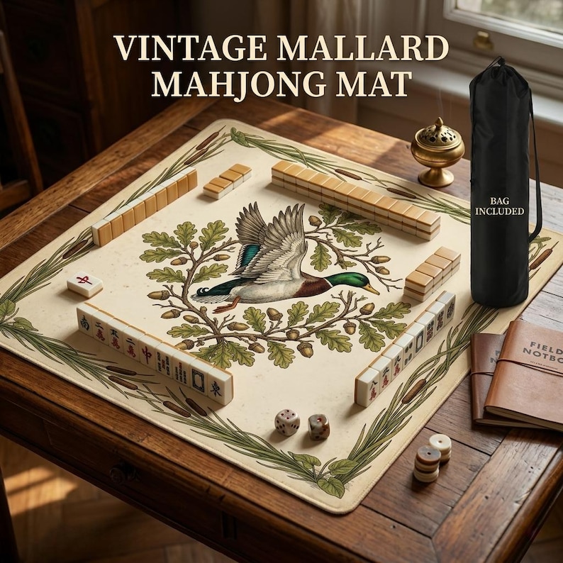 May include: Vintage Mahjong mat featuring a mallard duck illustration. The mat has a cream background with a green and brown border. Includes a black carrying bag. The game pieces and dice are visible on a wooden table.