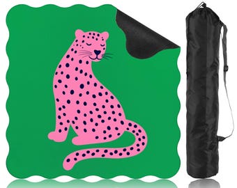 May include: A green yoga mat with a pink leopard design and black spots. The mat has a wavy edge and includes a black carrying bag. The text "Bag Included" is in the upper left corner.