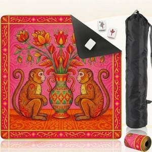 May include: A pink yoga mat with a vibrant illustration of two monkeys flanking a vase filled with flowers. The mat is rolled up with a matching strap and a black carrying bag is also included. Three Mahjong tiles are visible.