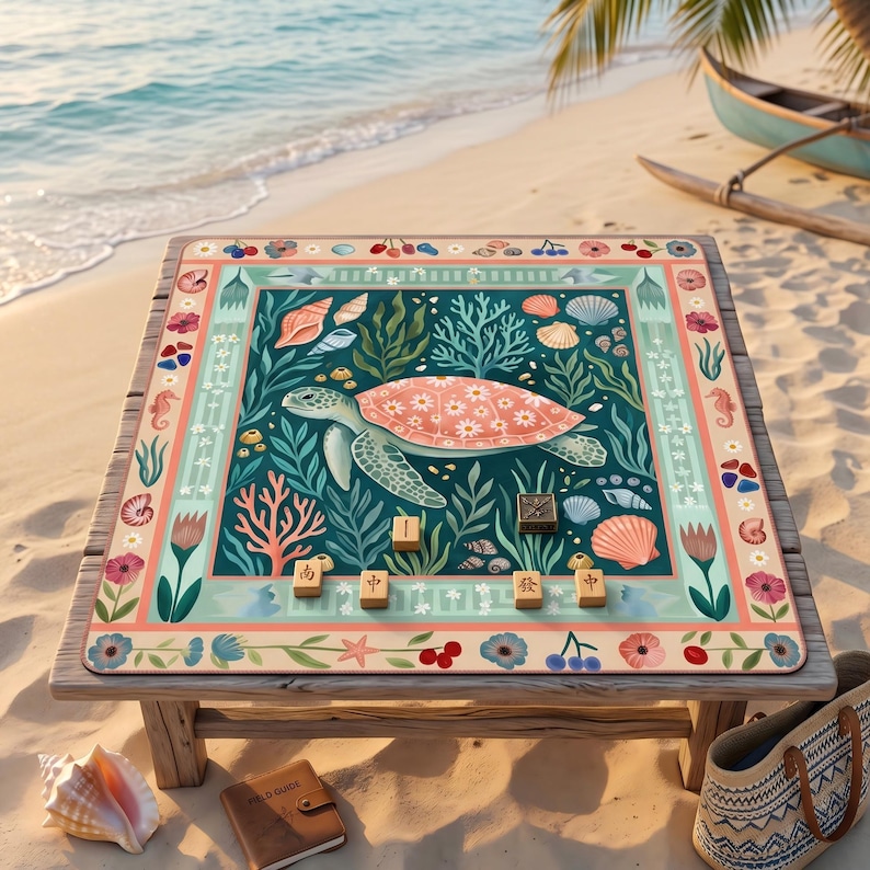 May include: A wooden table with a decorative mat featuring a sea turtle design. The mat has a teal background with coral, seashells, and floral accents. Wooden game pieces are arranged on the mat, with a beach and ocean backdrop.