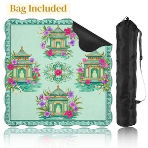 May include: A yoga mat with a teal background featuring a repeating pattern of pagodas, flowers, and water elements. The mat includes a black carrying bag. The words "Bag Included" are at the top of the image.
