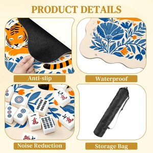 May include: Product details of a mahjong set, including an anti-slip mat with a tiger design, a waterproof surface with floral patterns, and a storage bag. The set also features noise reduction.