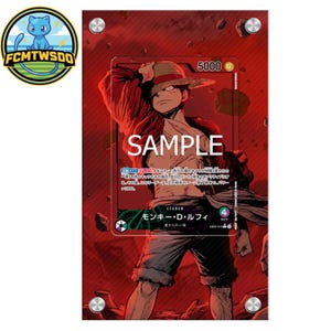 May include: A trading card featuring a manga-style illustration of a character in a straw hat, with the word "SAMPLE" overlaid. The card has Japanese text and a red background. The card is held in a clear protective case.
