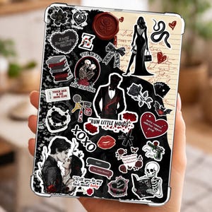 May include: A clear tablet case adorned with various stickers in a gothic theme. The stickers feature phrases like "Till Death" and "Run Little Mouse," along with images of skeletons, roses, and a silhouette of a woman in a dress. The background is black and cream.