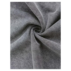 a close-up view of a wrinkled gray fabric, possibly denim or a similar type of material.