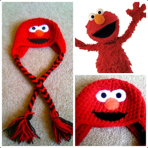 May include: Red crocheted hat with black and red braids and a red felt Elmo face with white eyes and a black mouth.