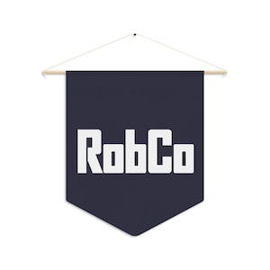May include: A navy blue pennant banner with the white text "RobCo". The banner is rectangular with a pointed bottom and is suspended from a wooden dowel with a string.