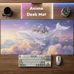 May include: Anime desk mat featuring a fantasy scene with a white whale floating in the clouds, with a village on its back. The mat has a keyboard and mouse on a wooden surface. The text "Anime Desk Mat" is displayed.