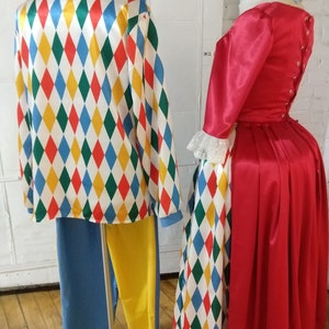 May include: A red and white harlequin patterned jacket with yellow and blue accents. The jacket is paired with blue and yellow pants. A red dress with a white lace collar and a harlequin patterned skirt.