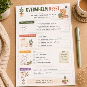 May include: A white paper planner sheet titled Overwhelm Reset with sections for feelings, priorities, and tasks. It features illustrations of a bear, a rabbit, plants, and clouds, with text prompts for mental health and daily organisation.