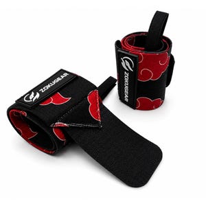 May include: A pair of black wrist wraps featuring a red cloud pattern. Each wrap includes a black rubber patch with the white text ZOKUGEAR and a logo. The wraps have a black elastic strap for securing the fit, with one wrap rolled up and the other partially unrolled to show the fabric design.
