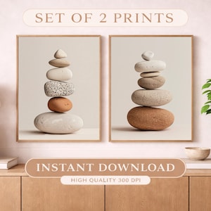 May include: Two framed prints featuring stacked stones in neutral tones. The stones vary in size, shape, and color, creating a balanced composition. The prints are labeled "SET OF 2 PRINTS" and "INSTANT DOWNLOAD".