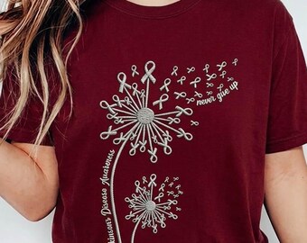 Camiseta de concienciación sobre la enfermedad de Parkinson, camiseta "Nunca te rindas" con diseño de diente de león, artículos de apoyo con lazo plateado, regalo para cuidadores de mamá.