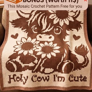 May include: A rectangular crochet blanket featuring a brown and cream mosaic pattern of a highland cow surrounded by sunflowers and hearts. The text "Holy Cow I'm Cute" is crocheted in brown at the bottom. The blanket has a solid brown border.