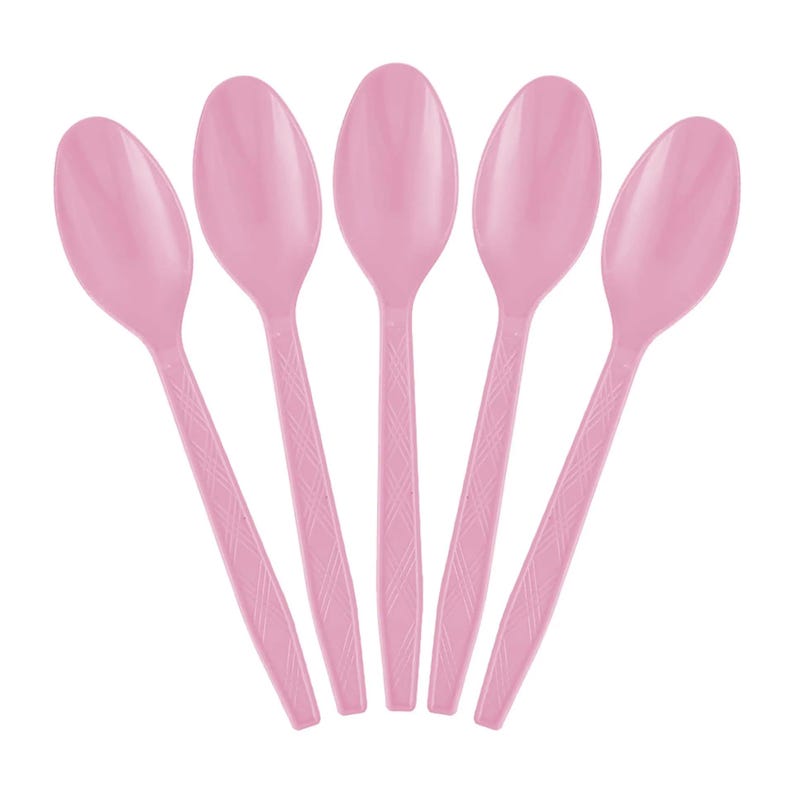 May include: Five pink plastic spoons arranged in a fan shape. Each spoon has an oval bowl and a handle with a diamond pattern. The spoons are a soft, pastel pink color, and the background is white.