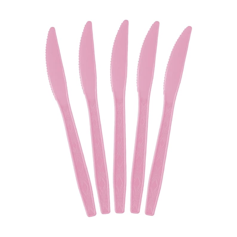 May include: Five pink plastic knives arranged vertically against a white background. Each knife has a serrated edge and a decorative pattern on the handle. The knives are a solid, light pink color.