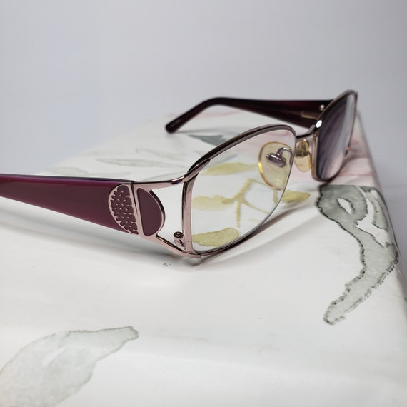 Pink metal eyeglasses or Gem