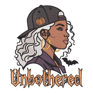 May include: An embroidery design featuring a profile of a person with wavy white hair wearing a black baseball cap with an orange pumpkin icon, gold hoop earrings, and a dark jacket. A small black bat and the text Unbothered are included.