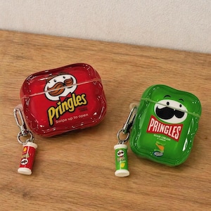 May include: Two AirPod cases, one red and one green, each shaped like a Pringles potato chip can. The red case has the Pringles logo and the text "Swipe up to open." The green case says "Sour Cream & Onion."