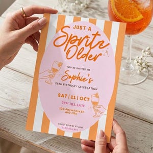May include: A birthday invitation with orange and white stripes, featuring the text "Just a Spritz Older" in orange script. The invitation is for Sophie's 28th birthday, with event details. A cocktail with an orange slice is in the background.