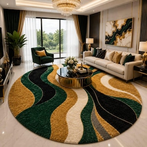May include: A large, round area rug with a flowing, abstract design in shades of gold, green, black, and white. The rug is placed in a living room setting, complementing the room's decor. The rug's design adds a modern touch to the space.