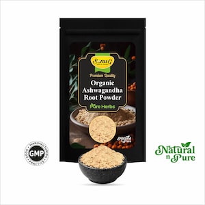 May include: A black pouch with the text "Organic Ashwagandha Root Powder" and "Pure Herbs". A small black bowl contains a pile of light brown powder. The image also includes a "GMP" seal and the words "Natural n Pure".