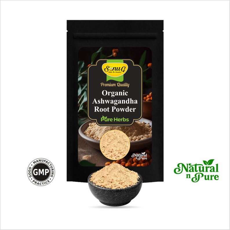 May include: A black pouch with the text "Organic Ashwagandha Root Powder" and "Pure Herbs". A small black bowl contains a pile of light brown powder. The image also includes a "GMP" seal and the words "Natural n Pure".