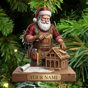 May include: A Christmas ornament featuring Santa Claus dressed in a red plaid shirt and brown work overalls with a tool belt. Santa holds a caliper over a miniature wooden house model. A rolled blueprint sits on a wooden base with a nameplate.