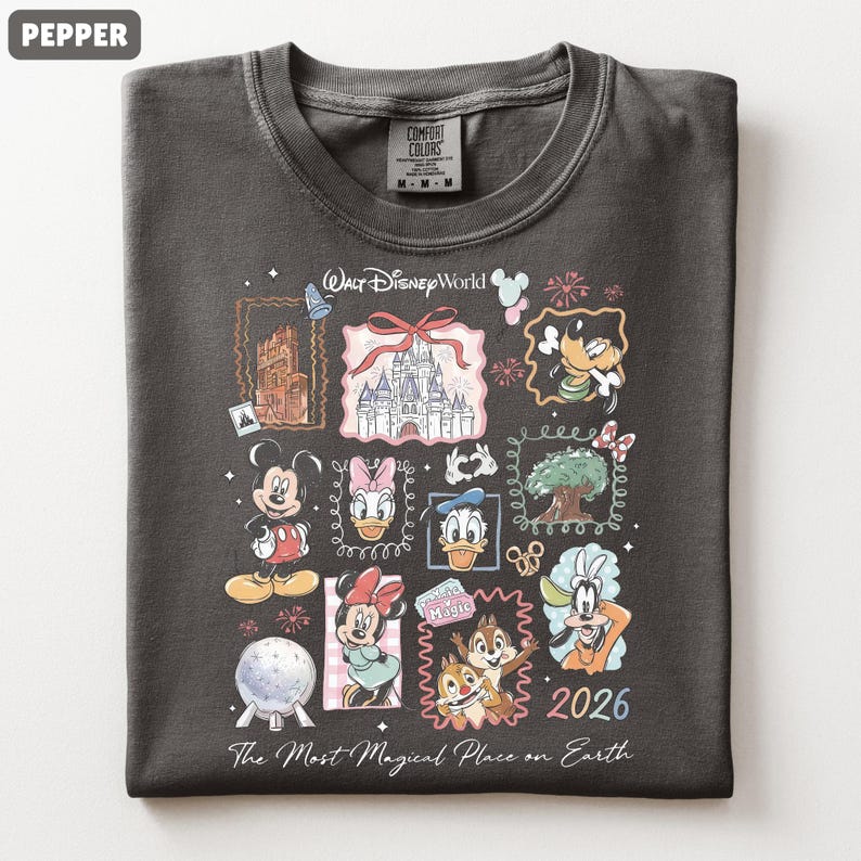 May include: Pepper-colored t-shirt featuring a collage of Disney World icons and characters. The design includes Mickey Mouse, Minnie Mouse, Donald Duck, and Chip and Dale, with the text "Walt Disney World" and "2026". The shirt is made of Comfort Colors material.