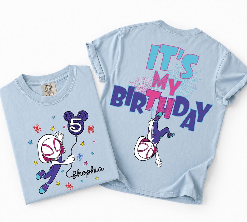 May include: Two light blue t-shirts. One features a cartoon character holding a balloon with the number 5 and the name "Shophia". The other shirt has the text "IT'S MY BIRTHDAY" and a character graphic. Both shirts have a spider-web design.
