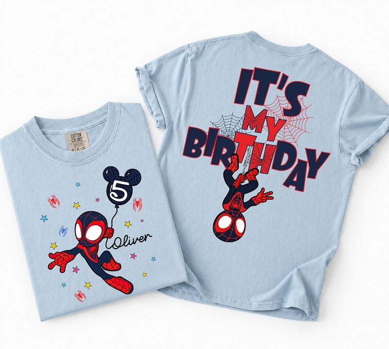 May include: Two light blue t-shirts. One features a cartoon Spider-Man with a balloon that says "5" and the name "Oliver". The other shirt has "IT'S MY BIRTHDAY" and a Spider-Man graphic on the back. Both shirts have a crew neck.