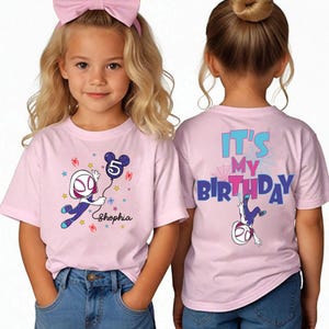 May include: Pink t-shirts with a Spider-Gwen graphic and the text "Shopia" and "It's My Birthday". The front of the shirt features Spider-Gwen holding a balloon with the number 5. The back of the shirt has the text "It's My Birthday".