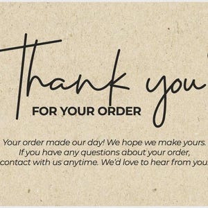 May include: A thank you card with the words "Thank you FOR YOUR ORDER" in black script. A small heart is drawn above the word "you". The card has a beige, textured background with additional text below.