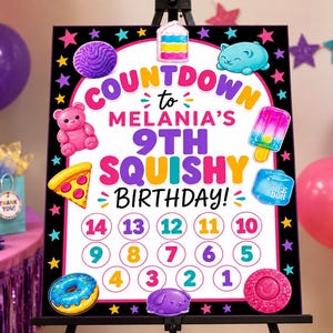May include: A rectangular birthday countdown sign featuring the text "COUNTDOWN to MELANIA'S 9TH SQUISHY BIRTHDAY!" surrounded by colorful illustrations of squishy toys, including a bear, pizza, donut, and cake, with numbered circles from 1 to 14.
