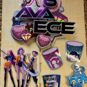 May include: A collection of cake toppers with the name "AVA ECE" and the number "6". The toppers include illustrations of anime-style characters, hearts, and food containers with names like "MIRA", "ZOEY", and "RUMI". The text "Polka Dot Cake" is also visible.