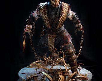 May include: A detailed Scorpion action figure from Mortal Kombat, wearing a yellow quilted vest and black ninja attire with blood splatters. The figure holds two metal chains with kunai blades and stands on a circular base featuring a skull.