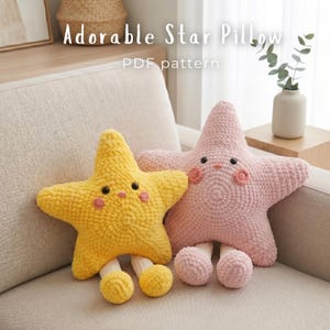 May include: Two star-shaped plush pillows with crochet texture, one yellow and one light pink. Each pillow features black eyes, a small mouth, and pink circular cheeks. Both pillows have dangling legs with rounded feet. Text reads: Adorable Star Pillow PDF pattern.
