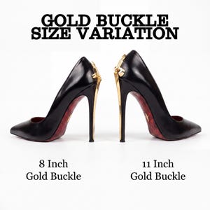 May include: Two black high-heeled pumps with pointed toes and red patterned soles. Each shoe features a gold-tone metal buckle detail on the heel. Text reads: GOLD BUCKLE SIZE VARIATION, 8 Inch Gold Buckle, and 11 Inch Gold Buckle.