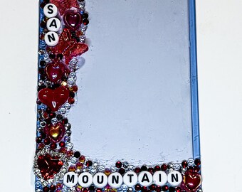 Protector de tarjetas fotográficas de San Mountain con diamantes de imitación rojos y negros y cuentas.