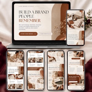 May include: A laptop and five smartphones displaying a website for Luxe Brand Studio. The screens feature a neutral colour palette with beige, cream, and deep brown tones, showcasing branding services, portfolio work, and text about brand identity.