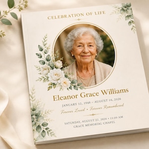 May include: A memorial program booklet titled Celebration of Life featuring a circular portrait of an elderly person with white hair. The cover is cream-colored with green watercolor floral accents, gold text, and details for Eleanor Grace Williams.