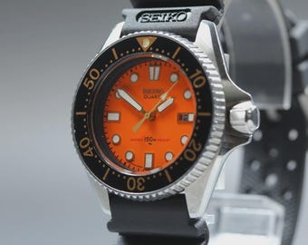 Reloj de cuarzo unisex SEIKO Diver 150m 2625-0010 naranja de 33 mm, año 1983 [Exc+5]