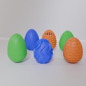 May include: A collection of six decorative Easter eggs in various colors and textures. The eggs include smooth green, ribbed blue, woven orange, textured green, and brick-patterned orange designs. These decorative eggs are perfect for Easter.